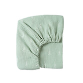 Meracorallo muslin fitted crib sheet in green leaf close-up for breathable sleep