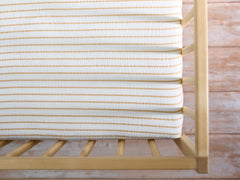 Meracorallo neutral stripe pattern adds chic nursery style
