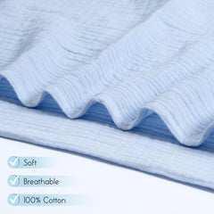 Baby wrapped in Meracorallo Muslin Swaddle Blanket, showcasing generous size for easy wrapping.