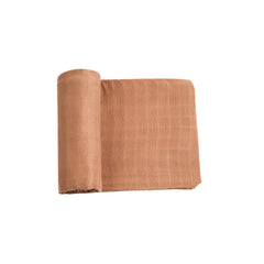 Meracorallo muslin swaddle in camel color offers breathable comfort for baby.