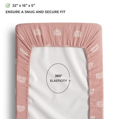 Meracorallo rainbow changing pad cover on mattress shows elastic edges for a snug fit.
