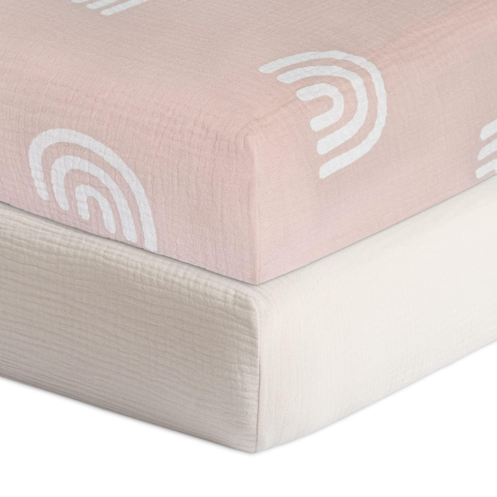 Meracorallo Rainbow Fog crib sheet folded, showcasing soft, breathable muslin for baby comfort.