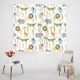 MESHELLY safari lion print curtains brighten the nursery window.