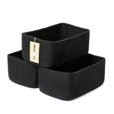 MiniArk small storage baskets in black on a shelf, ideal for organizing small items.