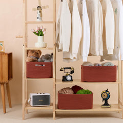 MiniArk nursery basket in oxide red helps store blankets and towels in a neat setup