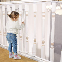 Minne Baby Banister Guard on stairs shows a secure 10ft barrier for children.