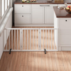 Mino Kesper white bamboo pet gate blocks doorway with style and safety.