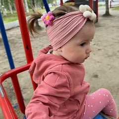 MIUXUESO baby flower headband pink front view, gentle elasticity for growing toddlers