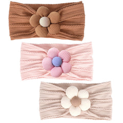 MIUXUESO baby flower headbands beige close-up showing soft elastic fit for newborns