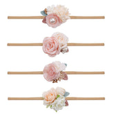Mligril baby nylon headbands with floral bows in closeup, soft and stretchable for gentle wear.