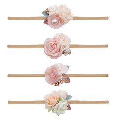 Mligril baby nylon headbands with floral bows in closeup, soft and stretchable for gentle wear.