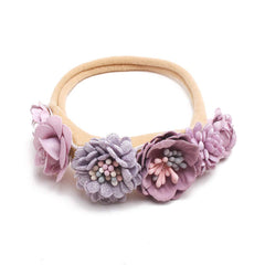 mligril headband close-up reveals plush fabric for gentle wear.