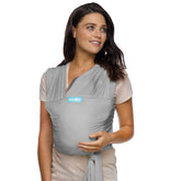 Moby Baby Wrap Classic worn by parent in stone grey for close, hands-free bonding.