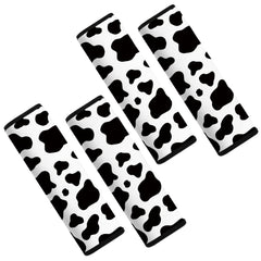 Mokiwala cow-pattern car seat belt pad cover seen from the front for comfortable cushioning.