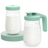Momcozy glass breast milk pitcher with flat lid for compact storage and safe pouring.