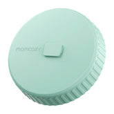 Momcozy glass milk pitcher lid close-up shows leak-proof seal for secure storage.