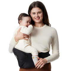 Momcozy hip-seat carrier in use for hands-free errands with baby.