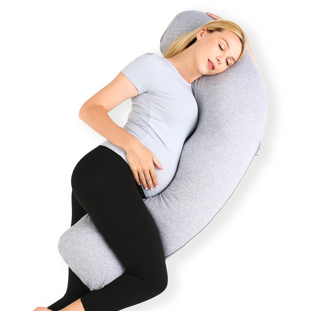 Momcozy J-shaped pregnancy pillow providing full-body support for side sleepers.