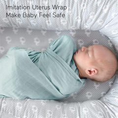 Momcozy swaddle blanket wrapped around a newborn for cozy security.