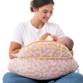 Momcozy Original nursing pillow with safety fence supports baby during feeding.