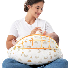 Momcozy Original nursing pillow with safety fence cradles baby for safer feeding.