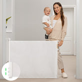 Momcozy retractable gate mesh extended to 71 inches for wide doorways and versatile spaces.