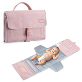 Mommore portable changing pad with open pockets for organized essentials.