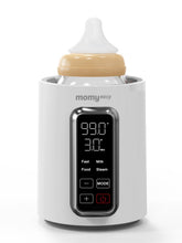 Momyeasy bottle warmer on its base delivering quick 2-minute heat for breastmilk and formula.