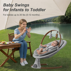 Monamii light-grey fabric swing with secure 5-point harness and plush padding.