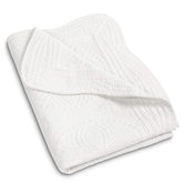 MONOBLANKS baby quilt with scalloped edge adds delicate nursery accent