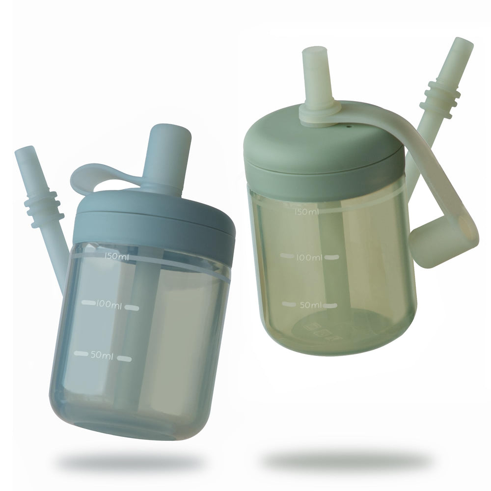 Moonkie Baby straw cup with lid on for spill-free practice during transitions.