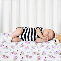 Moonsea snug-fit edge keeps sheets securely in place on standard cribs.
