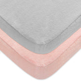 Moonsea 2-pack pack n play sheets with grey-pink colorway on a portable crib.