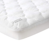 Moonsea waterproof crib mattress protector closeup showing breathable membrane and secure fit.
