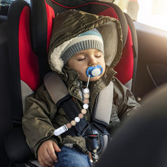 MORIBOX beige pacifier clip on clothing demonstrates secure everyday use