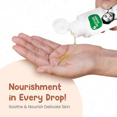 Mother Sparsh Ayurvedic Baby Massage Oil being massaged on baby's arm.