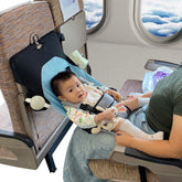 MueKeesam baby airplane bed front view for hands-free feeding and soothing during flights.