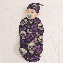 Muishi baby wrapped softly in the oval cocoon swaddle.