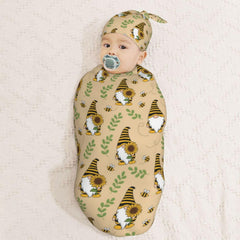 Folded Muishi Gnomes Bees Sunflowers swaddle blanket for easy use.