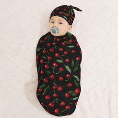 Muishi newborn hat set with swaddle blanket for cozy baby outfits.