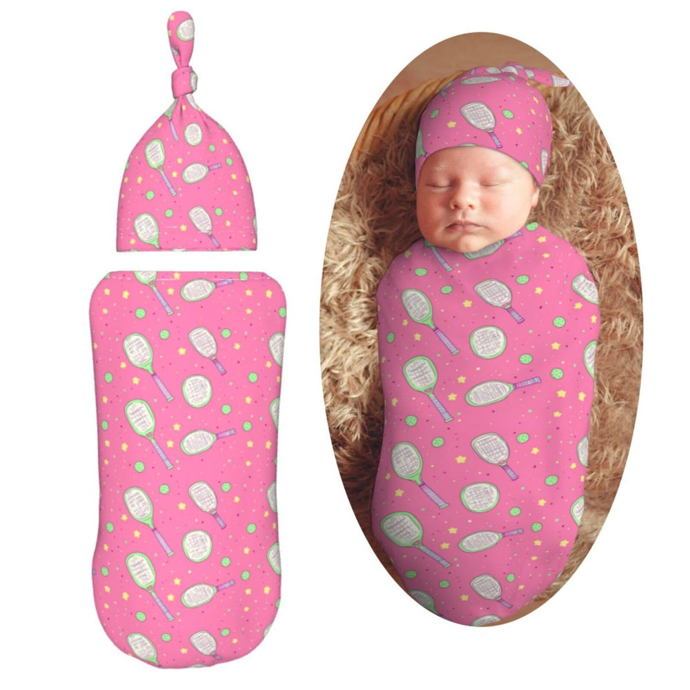 Muishi pickleball and stars swaddle blanket keeps baby snug for a peaceful nap.