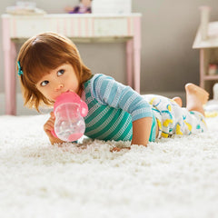 Munchkin any-angle straw cup enables sipping from any position.