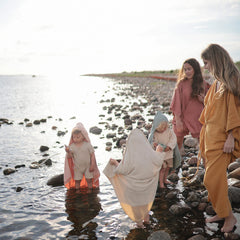 Mushie Baby Hooded Towel one-size design fits growing toddlers.