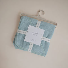 Mushie baby hooded towel Sea Mist drying, absorbent cotton stays warm and comfy.