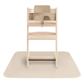 Mushie Baby Splat Mat under high chair for spill protection