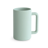 Mushie Bath Rinse Cup pours with controlled stream for gentle rinsing