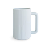 Mushie bath rinse cup front view for gentle, controlled rinsing.