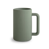 Mushie bath rinse cup with handle for easy, controlled rinsing.