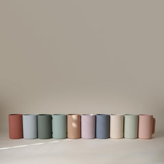 Mushie bath rinse cup textured exterior helps little hands hold steady.