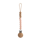 Mushie Eva pacifier clip blush beads keeps pacifier handy on-the-go.